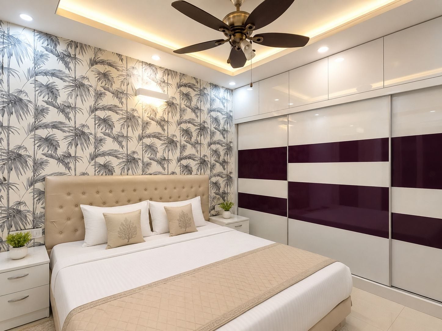 Bedroom with palm-leaf wallpaper and a striped wardrobe wall